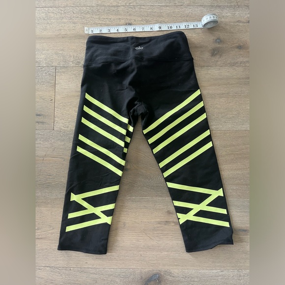 ALO YOGA Cropped Black Workout Leggings with Yellow Stripes - Picture 3 of 5